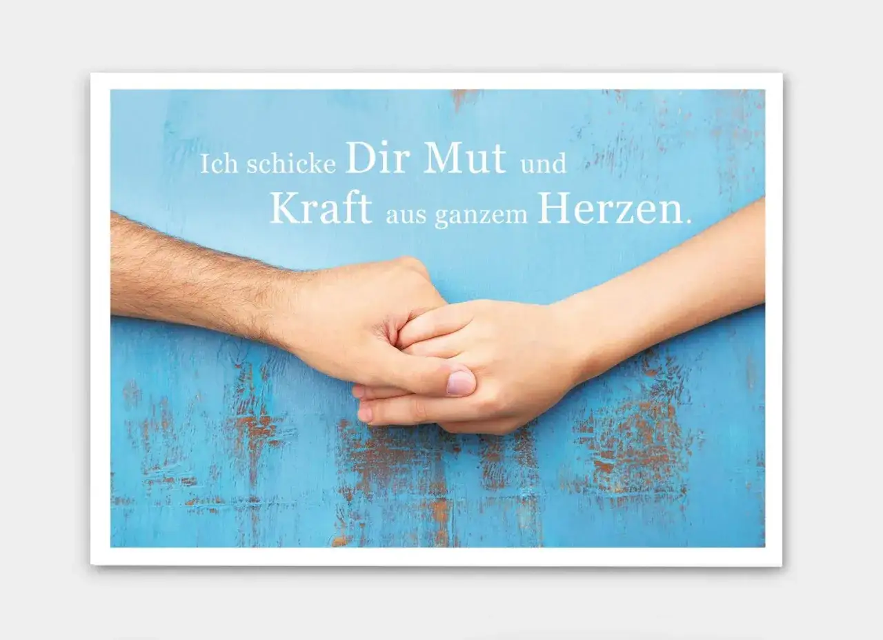 Zwei Hände halten sich fest. Ein Zeichen der Hoffnung und des Mutes für Krebspatienten. 